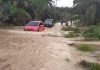 Akibat Curah Hujan, Sungai Kukun Genangi Jalan dan Rumah Warga