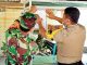 Sinergitas TNI-Polri, Babinsa Bersama Bhaminkamtibmas Polsek Rambah Berikan Imbauan Terkait Corona