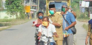 Kades Bangun Purba Timur Jaya Bagikan 2.000 Masker