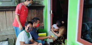 Lindungi Warga Dari Corona, Desa Rambah Hilir Bagi-Bagi Multivitamin dan Masker Gratis