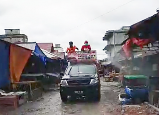 Cegah Penyebaran Covid-19, Pemerintah Kecamatan Semprot Disinfektan di Pasar Ujungbatu